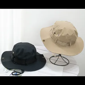 Detail of outdoor wide-brim sun hats with adjustable drawstrings and metallic side snaps