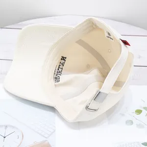 Neutral off-white cotton baseball cap with retro embroidery and metal buckle closure