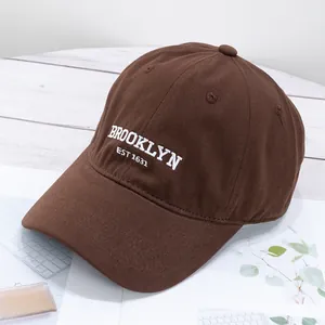 Detail of Brooklyn embroidery on vintage dark brown cotton canvas baseball cap