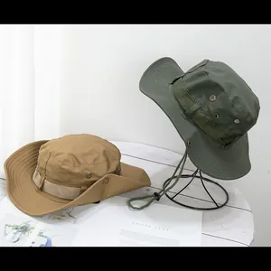 Detail of khaki and army green outdoor boonie hats with wide brims and adjustable chin straps