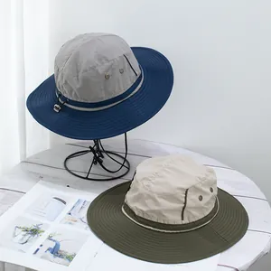 Detail of wide-brim sun hats with adjustable wind ropes and metal ventilation holes