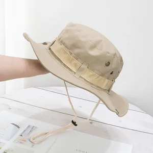 Detail of khaki outdoor bucket hat with wide brim, metal vents and adjustable chin strap