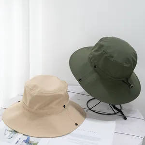 Detail of quick-dry sun hats in khaki and army green with windproof adjustable straps