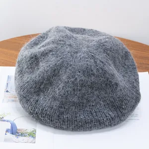 Detailed texture of dark grey mohair knitted beret with soft fluffy wool fibers