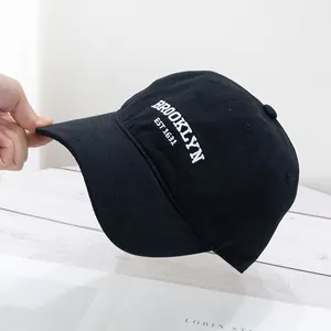 Close-up of black cotton baseball cap featuring Brooklyn EST 1631 white embroidery