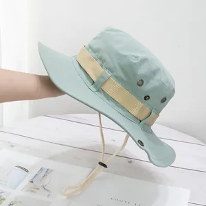 Detail of mint green hiking sun hat with side air vents and adjustable chin strap