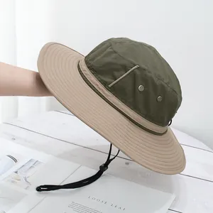 Detail of adjustable windproof drawstring and metal eyelet on wide brim sun hat