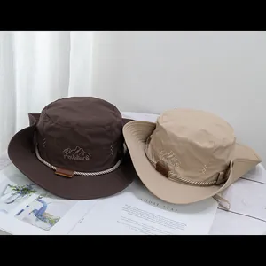 Breathable wide brim cowboy sun hats in dark brown and beige with travellerS embroidery