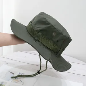Detail view of dark green sun hat featuring metal vents and adjustable wind rope