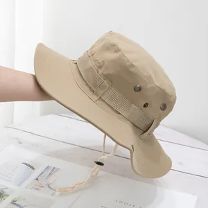 Detail of khaki outdoor sun hat with wide brim, metal vents and adjustable wind rope