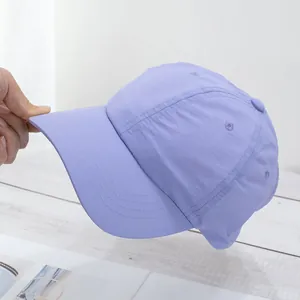 Detail of light purple quick-dry baseball cap showing breathable fabric and side profile