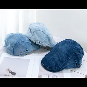 Retro denim newsboy caps in light, medium and dark blue washes with adjustable metal buckles