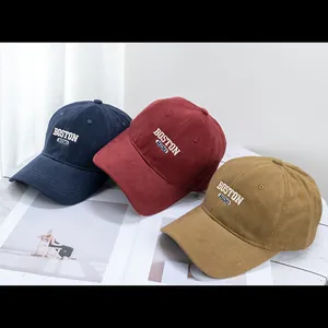 Detail view of cotton baseball caps with Boston 1630 embroidery in three colors