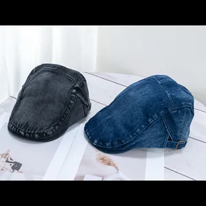 Detail of vintage denim ivy cap featuring adjustable metal buckle and contrast stitching