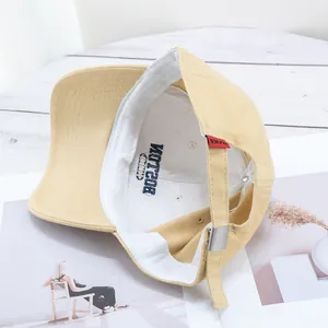 Classic light yellow cotton baseball cap featuring Boston embroidery and metal buckle strap