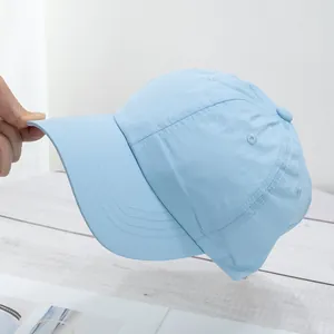 Detail shot of light blue quick-dry baseball cap brim with durable triple stitching
