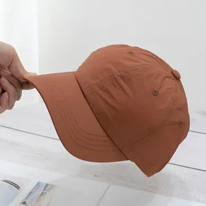 Close-up of quick-dry nylon baseball cap showing lightweight texture and reinforced brim