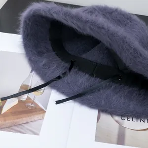 Plush purple angora bucket hat with interior adjustable strap for winter warmth