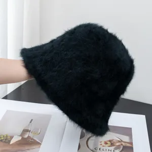 Close-up of black fluffy bucket hat in rabbit fur texture for winter warmth