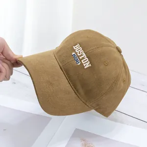Detail of Boston embroidery on khaki corduroy baseball cap with high quality texture