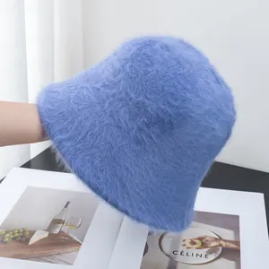 Detail of soft royal blue faux fur bucket hat with fluffy texture and warm plush material