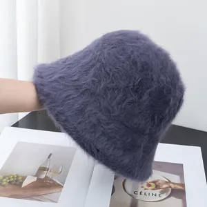 Detailed view of plush long rabbit fur texture on a dark purple knit bucket hat