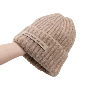 Minimalist camel wool blend knit beanie for women featuring a cozy rolled cuff design