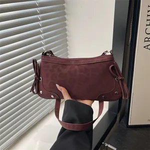 Matte burgundy leopard print underarm bag with side bows and silver studs