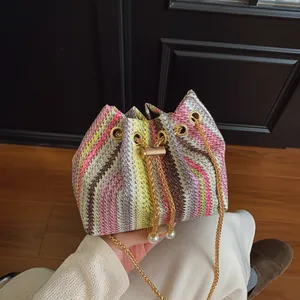 Women Woven Striped Bucket Bag Artificial Pearl Drawstring Chain Shoulder Crossbody Bag Fashion Straw Handbag Vacation Beach Purse