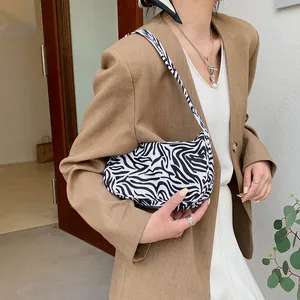 Contrast zebra print underarm bag for women with minimalist shoulder strap and chic design