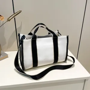 Minimalist black and white contrast tote bag for women with crossbody shoulder strap