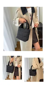 Detail view of black puffer tote bag with quilted texture and detachable crossbody strap