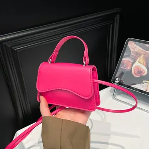 Modern fuchsia mini square handbag with wave flap and shoulder strap for women