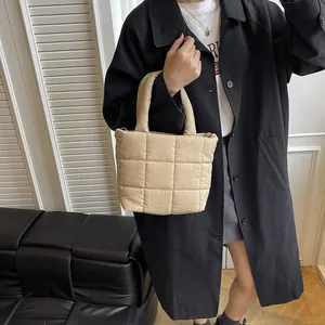 Stylish beige quilted cotton puffer tote bag with top handles for winter fashion