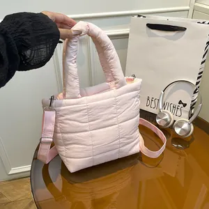 Light pink quilted tote bag with detachable strap and fluffy texture for casual wear