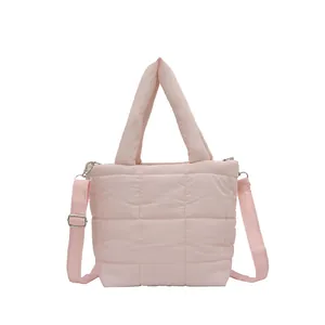 Pink quilted down tote bag with plush shoulder strap and crossbody design for women