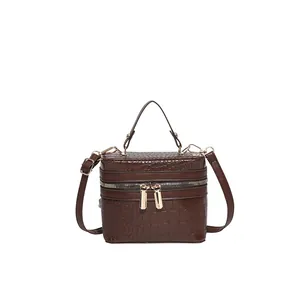 Brown crocodile embossed box handbag with top handle and gold zipper closure
