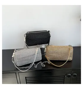Three sequin rhinestone bags in black, gold, silver with pearl straps and chain details