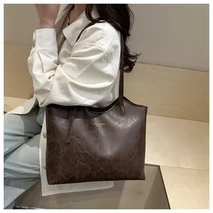 Deep brown tote bag with vintage texture shown on shoulder for a stylish daily commute