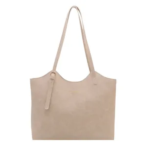 Minimalist beige PU leather tote bag with gold lettering and slim shoulder strap