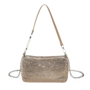 Champagne gold rhinestone evening clutch bag with pearl accents and silver metal chain