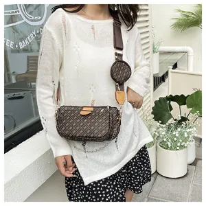 Three-in-one dark brown crossbody bag with vintage pattern and gold chain detail