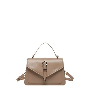 Minimalist beige PU leather crossbody bag with envelope flap and gold metal buckle