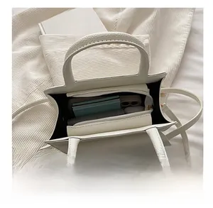 Overhead view showing large interior capacity of the white lychee grain leather handbag