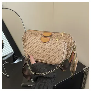 Three-in-one beige crossbody bag set with geometric patterns and gold chain detail
