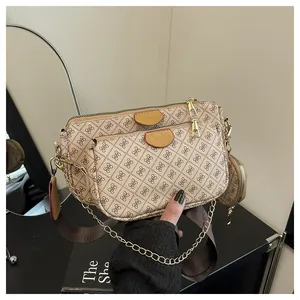 Close-up of beige 3-in-1 crossbody bag set with logo pattern and woven shoulder strap