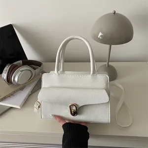 Chic white lychee grain leather handbag with gold twist lock for stylish commuting