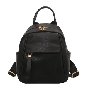 Women's black soft leather backpack with golden zippers and lychee grain texture