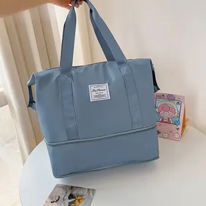 Detail of blue travel bag with dry-wet separation bottom compartment and fashion patch