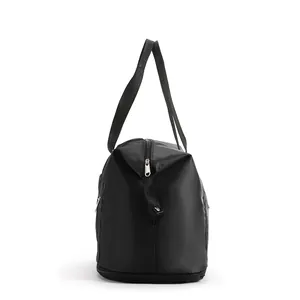 Side view of a large black travel bag featuring silver metal zippers and woven handles